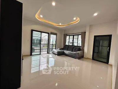 Spacious modern living room with sleek design and ample natural light