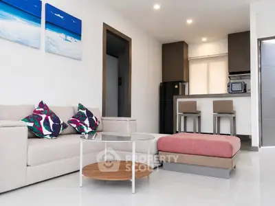 Modern living room with stylish furniture and open kitchen layout