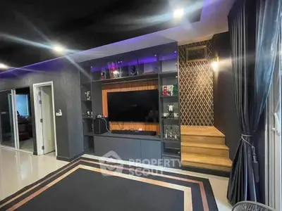 Luxurious modern living room with stylish built-in entertainment center and ambient lighting.