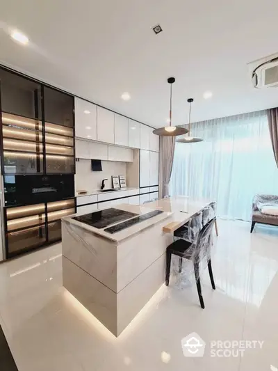 Luxurious modern kitchen with sleek island and elegant lighting