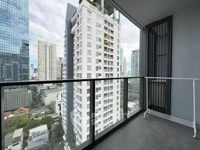 Modern high-rise balcony with stunning cityscape views in urban setting.