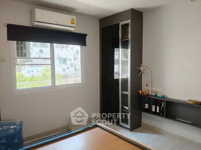 Modern bedroom with air conditioning and sleek storage solutions