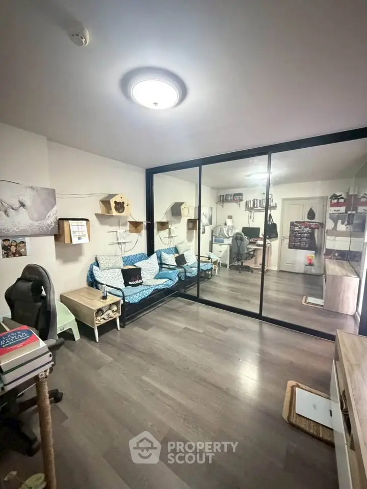 Modern living room with glass partition and stylish decor