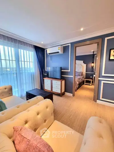 Luxurious living room with elegant decor and cozy bedroom view
