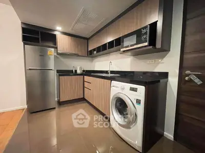 Modern kitchen with sleek appliances and stylish cabinetry