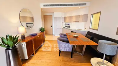 Stylish modern living room with open kitchen and elegant dining area