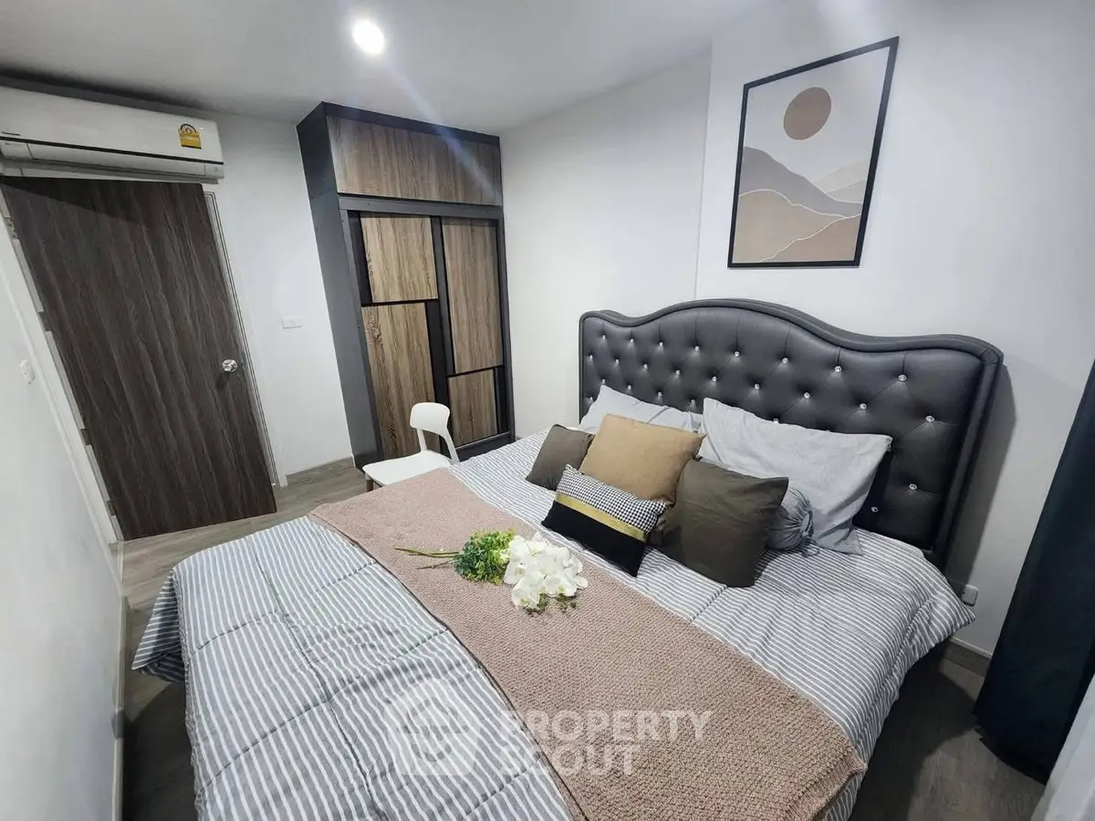 Cozy bedroom with stylish decor and modern furniture, featuring a comfortable bed and elegant wardrobe.