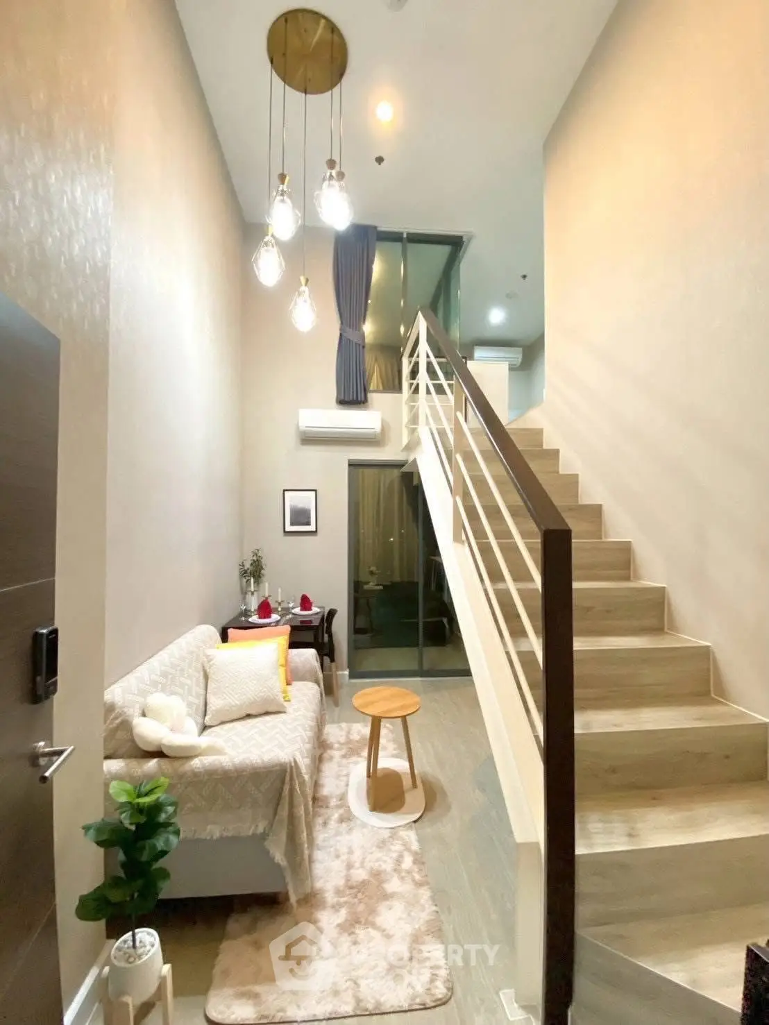 Modern loft-style living room with high ceiling and elegant staircase