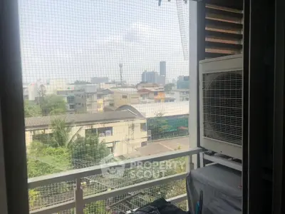 Charming balcony with city view, perfect for relaxation and enjoying urban scenery.