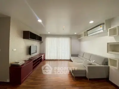 Spacious living room with modern decor and natural light