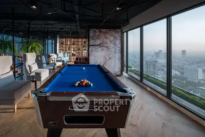 Luxurious high-rise lounge with pool table and stunning city view