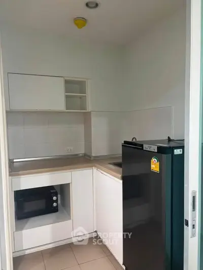 Compact modern kitchen with sleek appliances and minimalist design