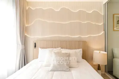 Modern bedroom with elegant lighting and cozy decor