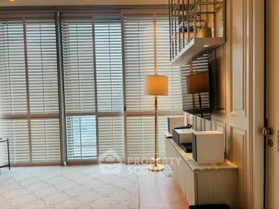 Elegant living room with floor-to-ceiling windows and modern decor