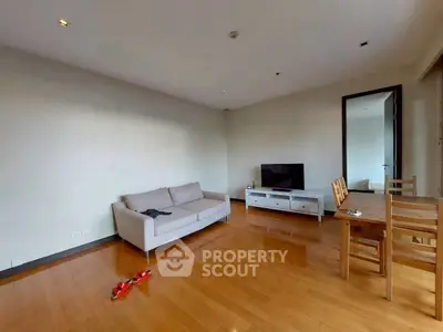 Spacious living room with wooden flooring and modern furniture