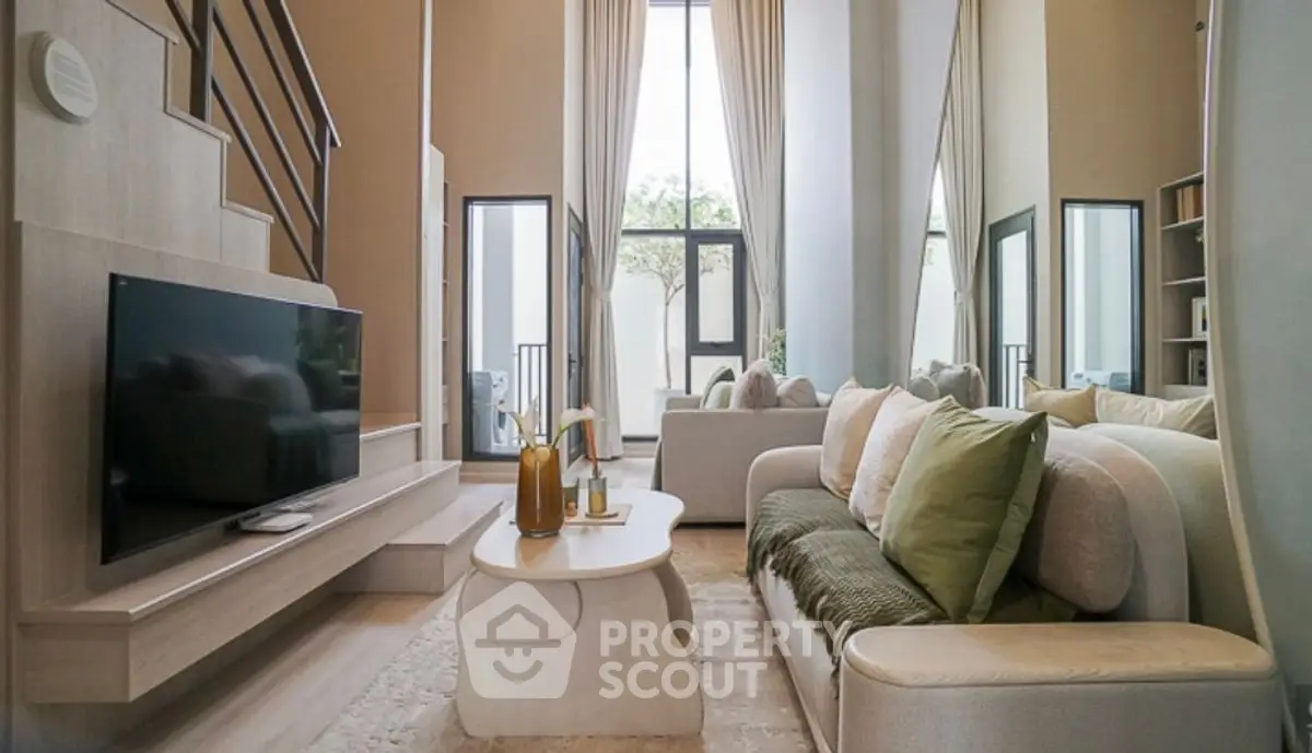 Luxurious modern living room with high ceilings and elegant decor