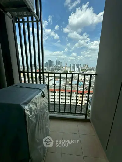 Stunning cityscape view from a modern balcony with protective cover on air conditioning unit.