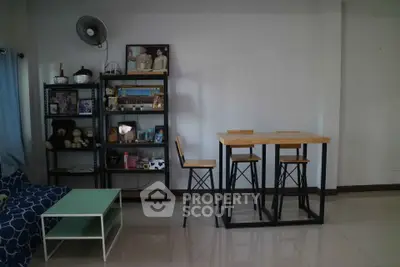 Modern living room with stylish dining set and organized shelving