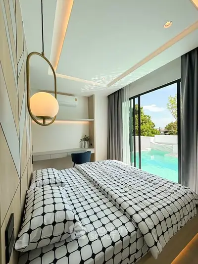 Modern bedroom with pool view and stylish geometric decor