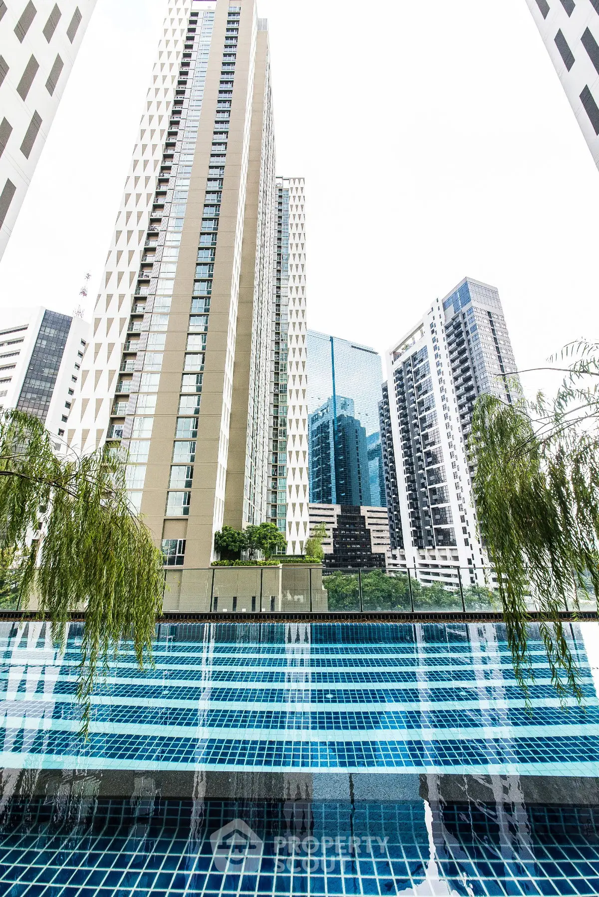 Luxurious urban high-rise with stunning pool and cityscape view