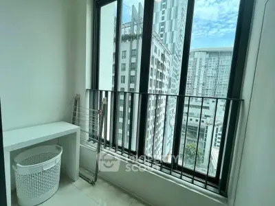 Bright apartment balcony with city view and laundry area