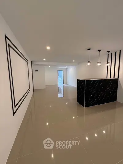 Sleek modern interior with glossy tiles and stylish lighting in open layout