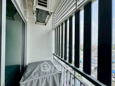 Modern balcony with city view and air conditioning unit, perfect for urban living.