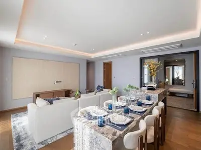 Luxurious open-plan living and dining area with elegant decor and modern furnishings.