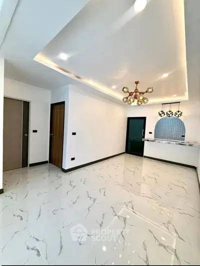 Modern living room with elegant lighting and marble flooring