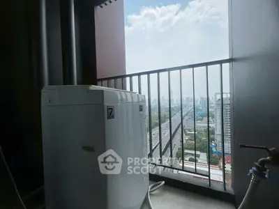 High-rise balcony with washing machine and stunning city view, perfect for urban living.