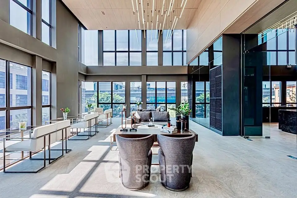Luxurious modern living room with high ceilings and expansive windows offering stunning city views.