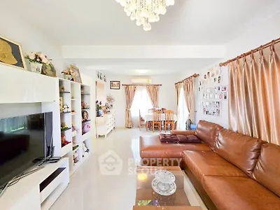 Spacious living room with leather sofa and elegant decor in a modern home
