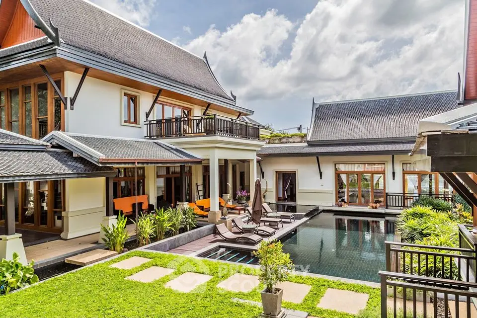 Luxurious tropical villa with private pool and lush garden, perfect for serene living.