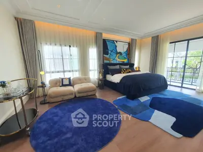 Luxurious bedroom with modern decor and balcony access