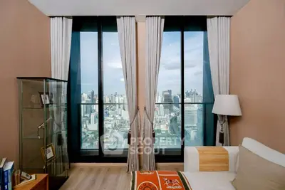 Luxurious living room with stunning city view from floor-to-ceiling windows