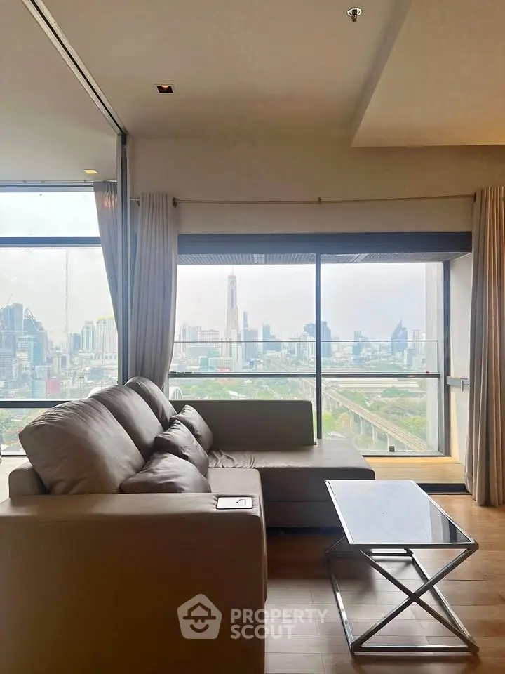 Luxurious living room with stunning city view from high-rise apartment