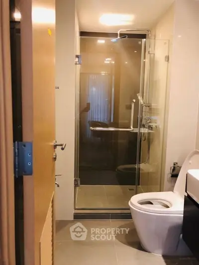 Modern bathroom with glass shower and sleek fixtures