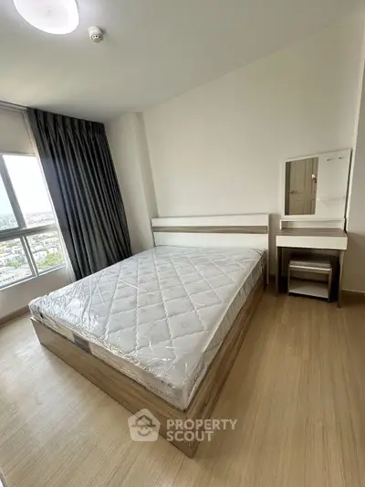 Modern bedroom with large window and minimalist furniture