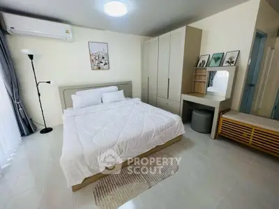 Spacious modern bedroom with elegant decor and ample storage space