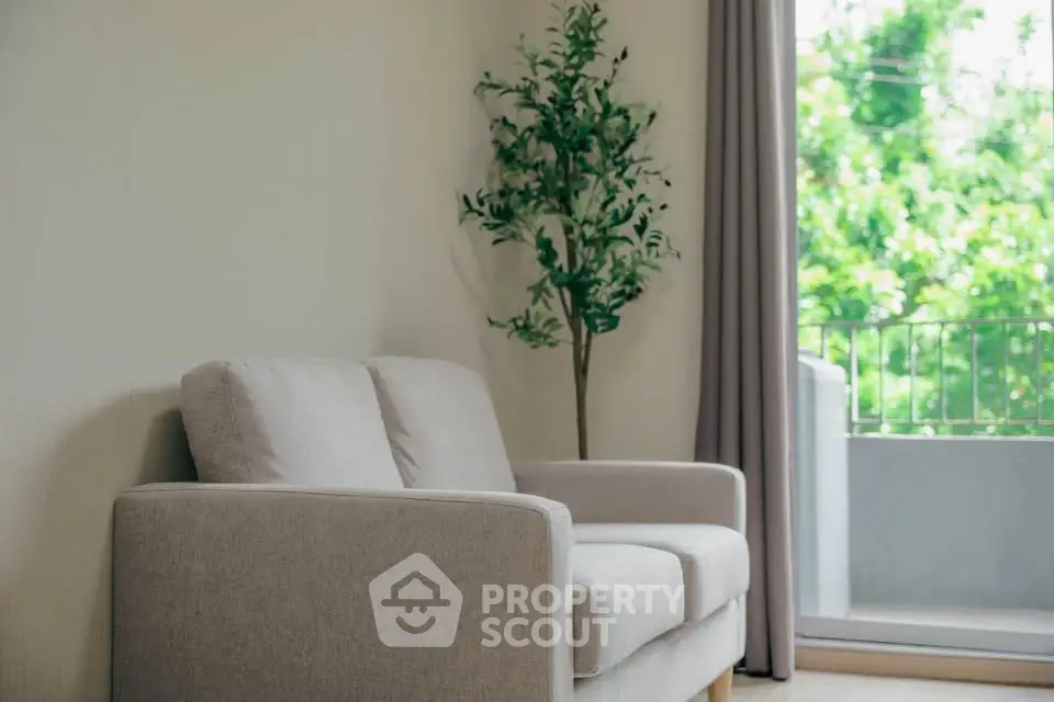 Cozy living room with modern sofa and balcony view