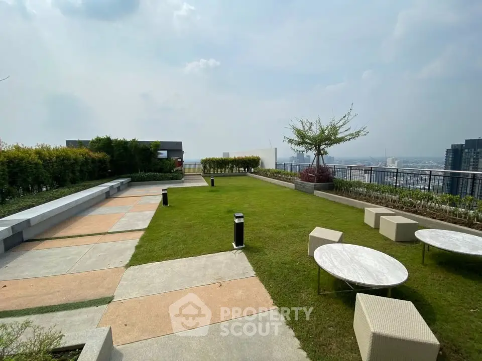 Stunning rooftop garden with panoramic city views and modern seating area.