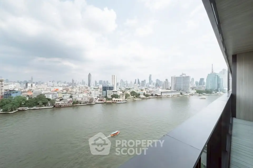 Stunning river view from high-rise balcony overlooking city skyline