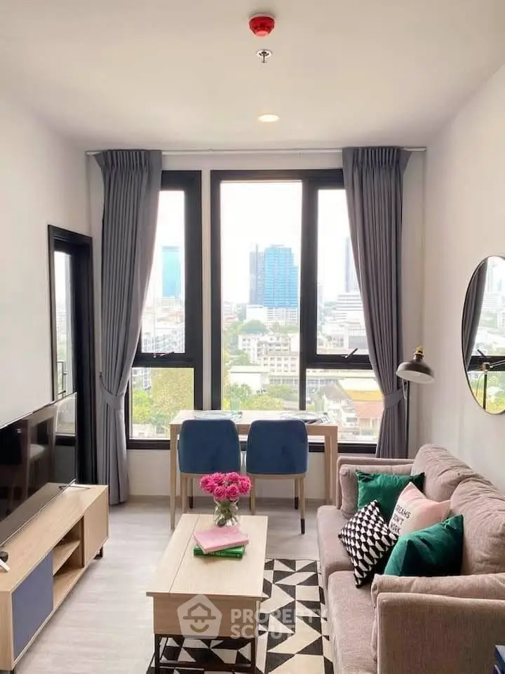 Chic modern living room with city view, stylish decor, and ample natural light.