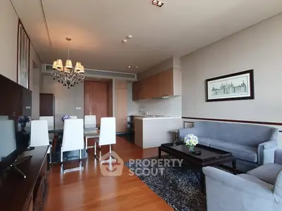 Spacious modern living room with elegant dining area and open kitchen layout.