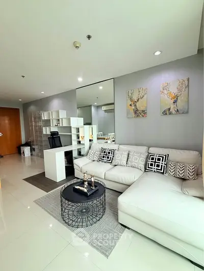 Modern living room with stylish decor and comfortable seating in a contemporary apartment.