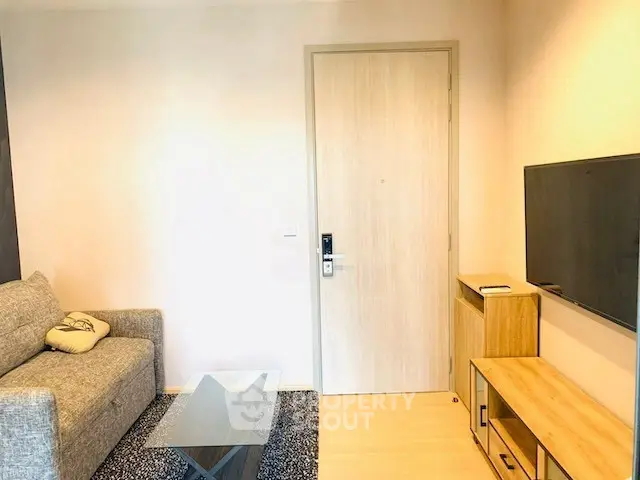 Modern living room with cozy sofa and wall-mounted TV