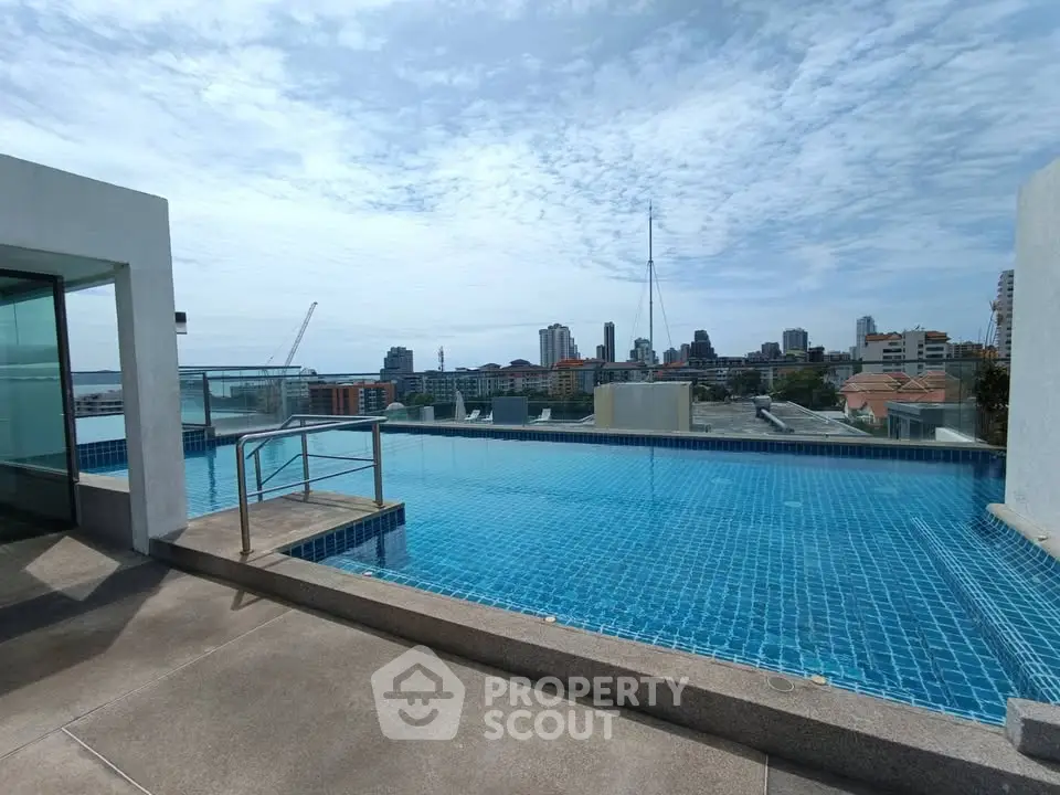 Stunning rooftop pool with panoramic city views in modern urban setting.