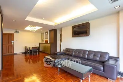 Spacious modern living room with elegant leather sofa and stylish lighting