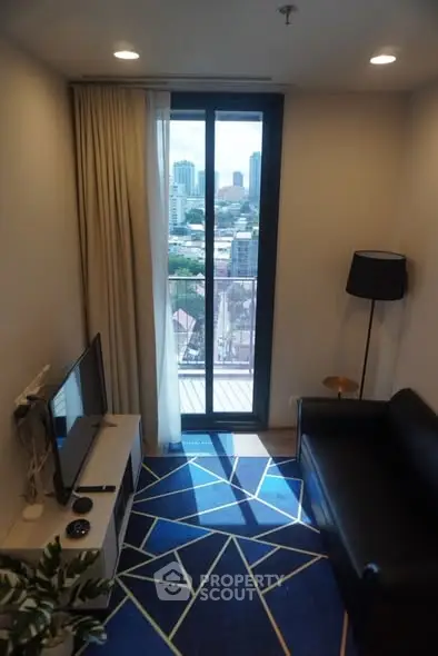 Chic living room with city view, modern decor, and cozy ambiance.