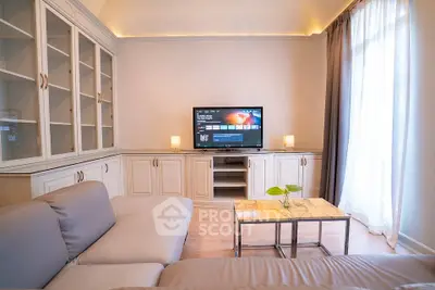Elegant living room with modern TV setup and stylish furniture
